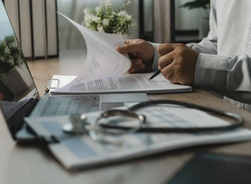 Physician reviewing medical records and attesting a Future Care Projection